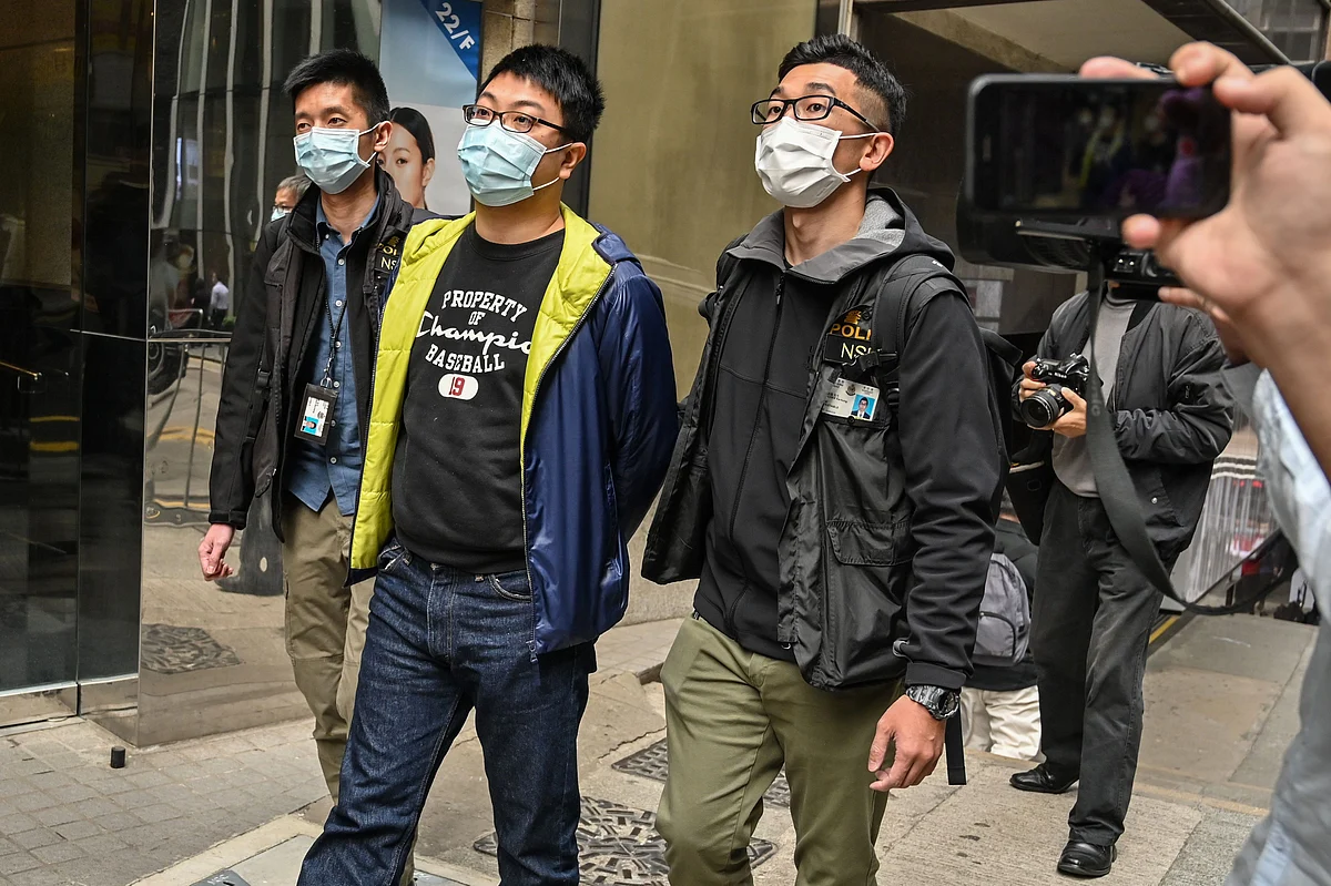 Ben Chung (2nd R) of a pro-democracy political group is arrested by police in the Central district after as many as 50 Hong Kong opposition figures were arrested in Hong Kong on 6 January