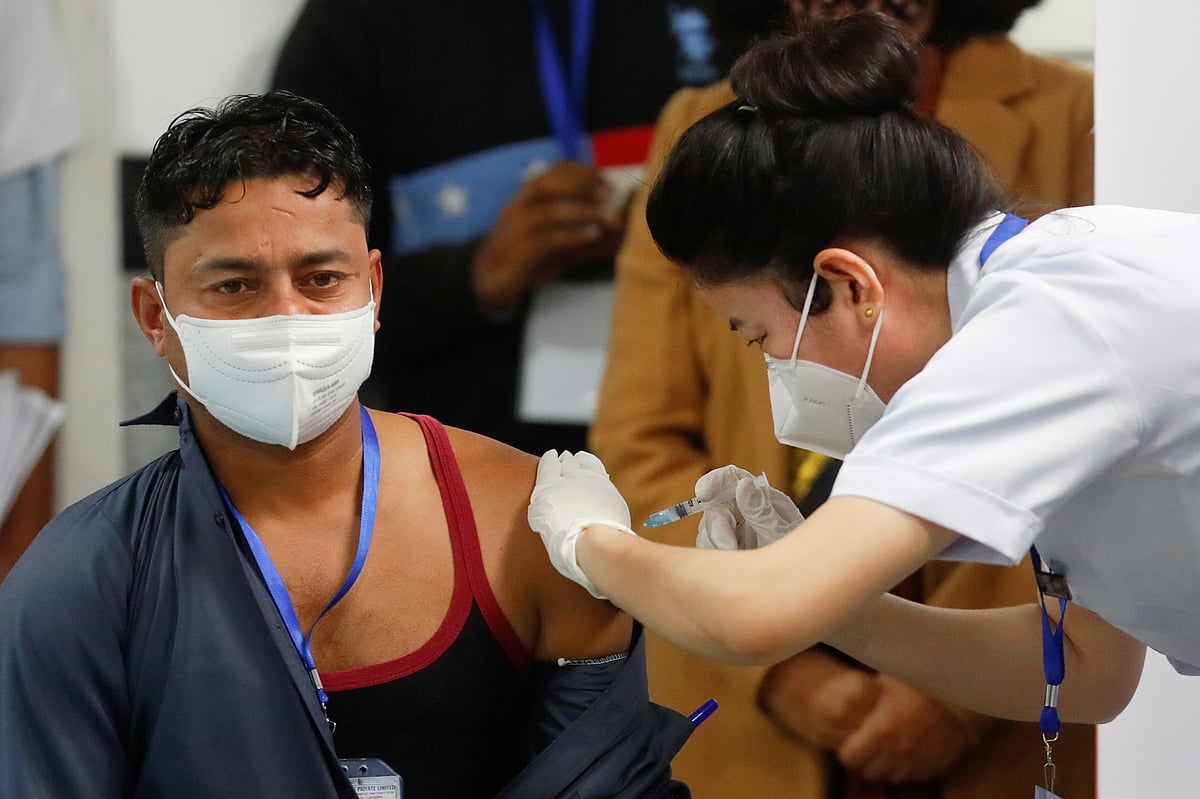 Sanitation worker Manish Kumar, who according to the officials is the first person in the country vaccinated against the COVID-19, receives a dose of Bharat Biotech's COVAXIN during the coronavirus disease (COVID-19) vaccination campaign at All India Institute of Medical Sciences (AIIMS) hospital in New Delhi, India, 16 January , 2021
