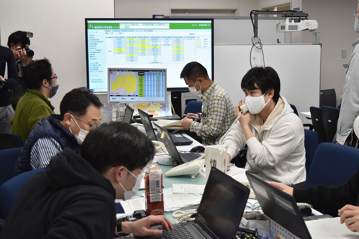Government officials work at the disaster response headquarters in Fukushima Prefectural office on February 13, 2021 after a 7.1-magnitude earthquake struck late on February 13 off the eastern coast of Japan