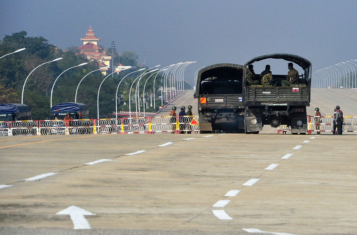 Soldiers stand guard along a blockaded road near Myanmar's parliament in Naypyidaw on 2 February 2021, as Myanmar's generals appeared in firm control a day after a surgical coup that saw democracy heroine Aung San Suu Kyi detained