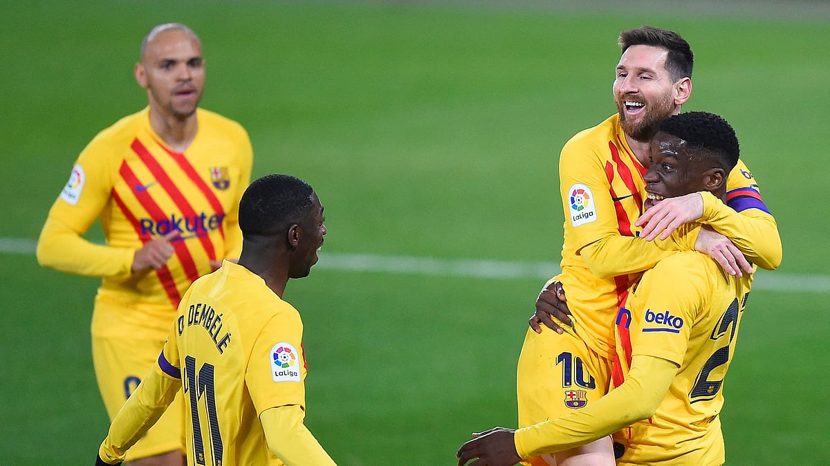 elona's Argentinian forward Lionel Messi , Barcelona's French forward Ousmane Dembele and Barcelona's Danish forward Martin Braithwaite after scoring during the Spanish League football match between CA Osasuna and FC Barcelona at El Sadar stadium in Pamplona on 6 March 2021