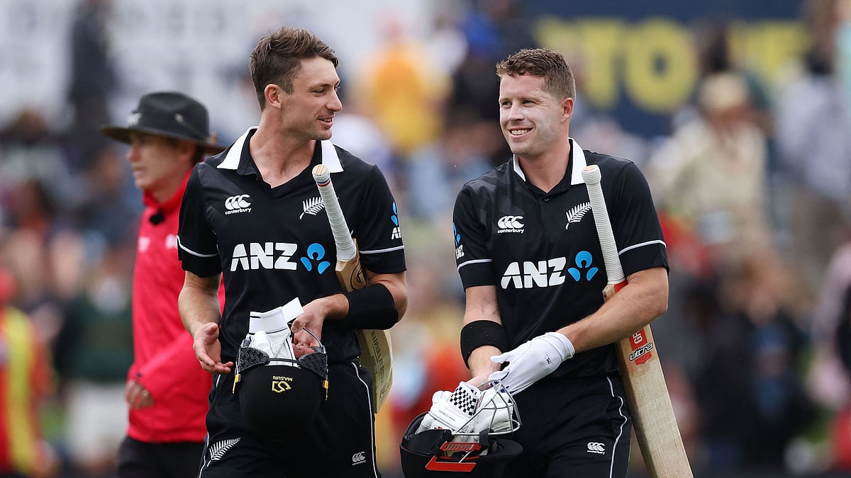 New Zealand's Henry Nicholls (R) and Will Young (L) walk from the field after their win during the 1st cricket ODI match between New Zealand and Bangladesh at University Oval in Dunedin on 20 March 2021