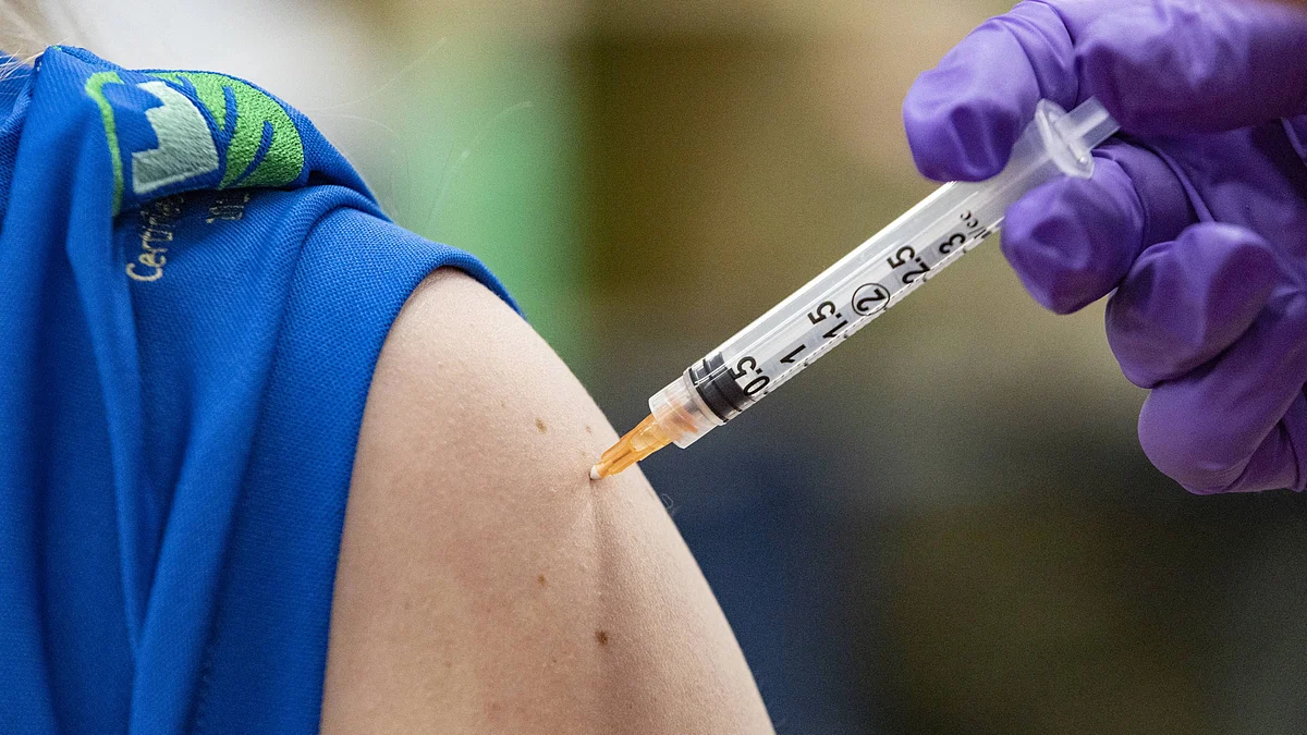 Bethany Ross receives the Covid-19 Johnson & Johnson Janssen vaccine as part of a collaborative effort from the West Virginia National Guard, FamilyCare Health Centers and Toyota to vaccinate Toyota employees on 26 March 2021 on the grounds of the Toyota plant in Buffalo, West Virginia