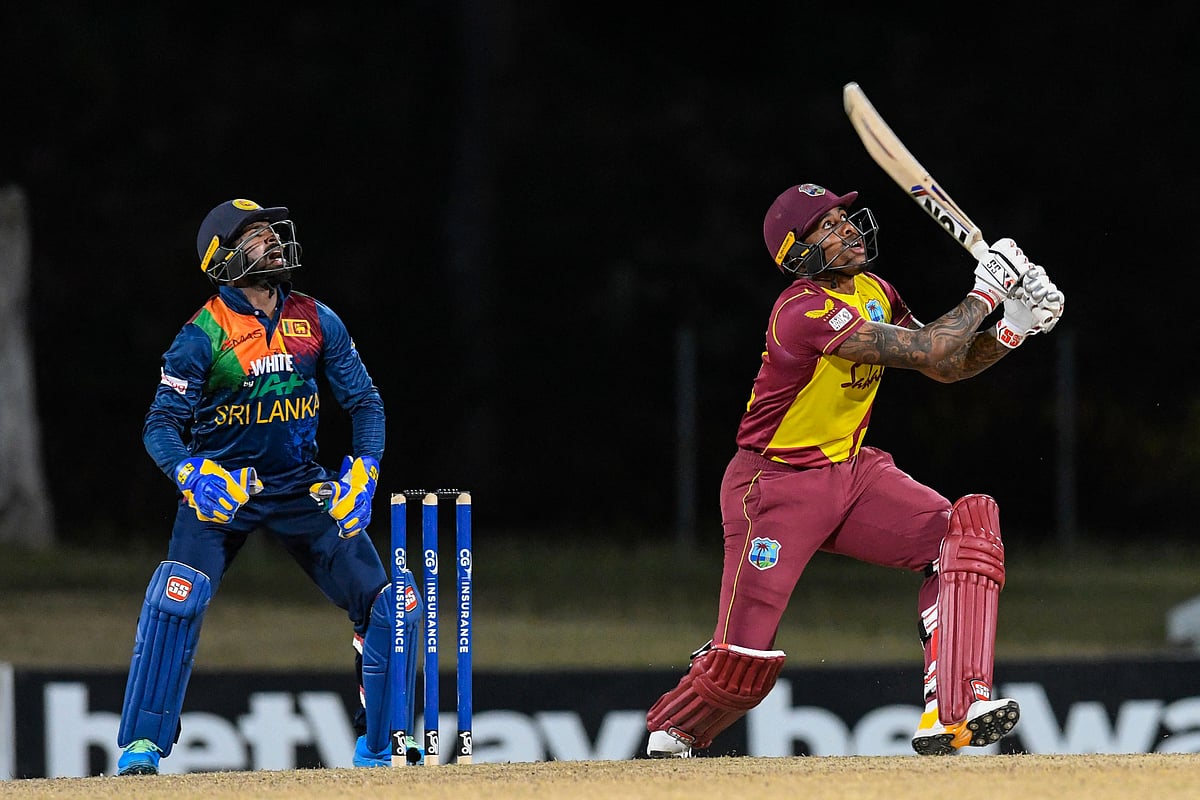 Fabian Allen (R) of West Indies hitting the winning runs as Niroshan Dickwella (L) of Sri Lanka watch during the 3rd and final T20i match between Sri Lanka and West Indies at Coolidge Cricket Ground in Osbourn, Antigua and Barbuda on 7 March , 2021
