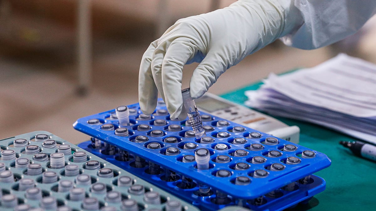 A health worker tags samples collected for testing Covid-19 infection at Mugda Medical College Hospital, Dhaka