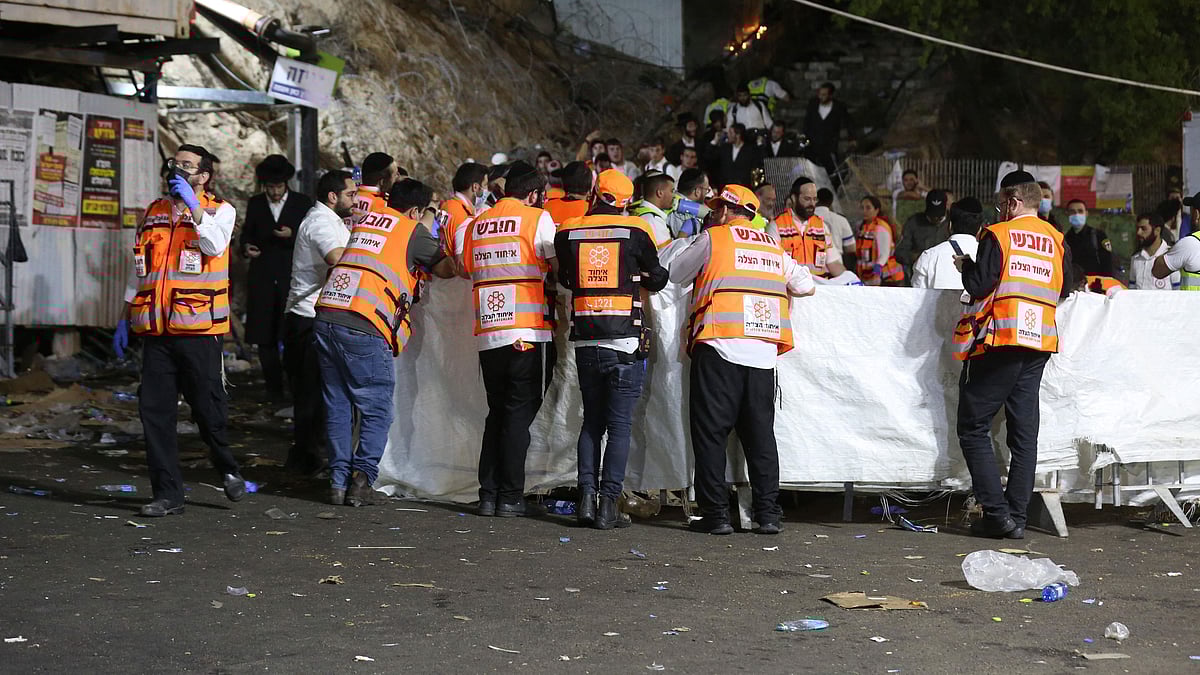 Emergency workers gather at the scene after dozens of people were killed and others injured after a grandstand collapsed in Meron, Israel, where tens of thousands of people were gathered to celebrate the festival of Lag Ba'omer at the site in northern Israel early on 30 April 2021