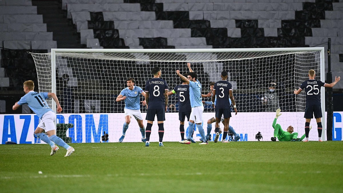 Manchester City's players celebrate after scoring a goal during the UEFA Champions League first leg semi-final football match between Paris Saint-Germain (PSG) and Manchester City at the Parc des Princes stadium in Paris on 28 April 2021