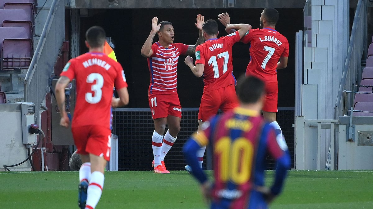 Granada's Venezuelan forward Darwin Machis (C) celebrates with teammates after scoring during the Spanish League football match between Barcelona and Granada at the Camp Nou stadium in Barcelona on 29 April 2021