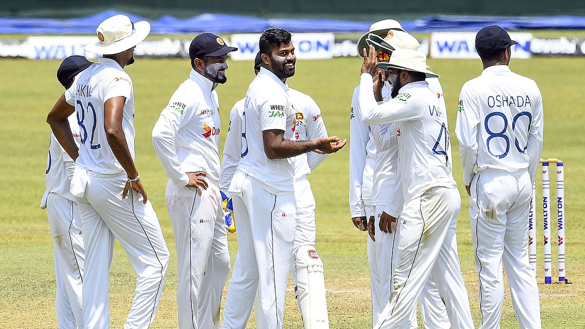 Sri Lanka's Lahiru Kumara (C) celebrates with teammates after the dismissal of Bangladesh's Najmul Hossain Shanto (not pictures) during the second day of the first Test cricket match between Sri Lanka and Bangladesh at the Pallekele International Cricket Stadium in Kandy on 22 April 2021