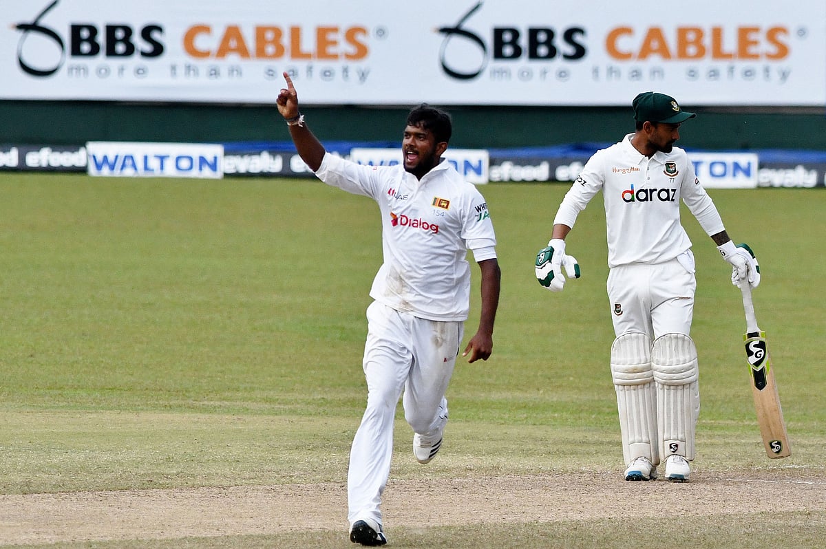 Sri Lanka's Ramesh Mendis celebrates after he dismissed Bangladesh's Mushfiqur Rahim during the fourth day of the second and final Test cricket match between Sri Lanka and Bangladesh at the Pallekele International Cricket Stadium in Kandy on 2 May, 2021