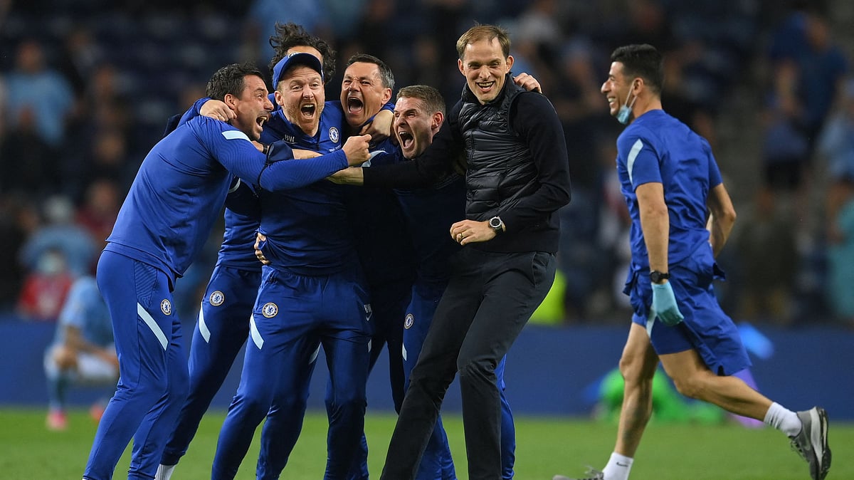 Chelsea's German coach Thomas Tuchel (2nd-R) celebrates with Chelsea's staff members after winning the UEFA Champions League final football match between Manchester City and Chelsea FC at the Dragao stadium in Porto on 29 May 2021