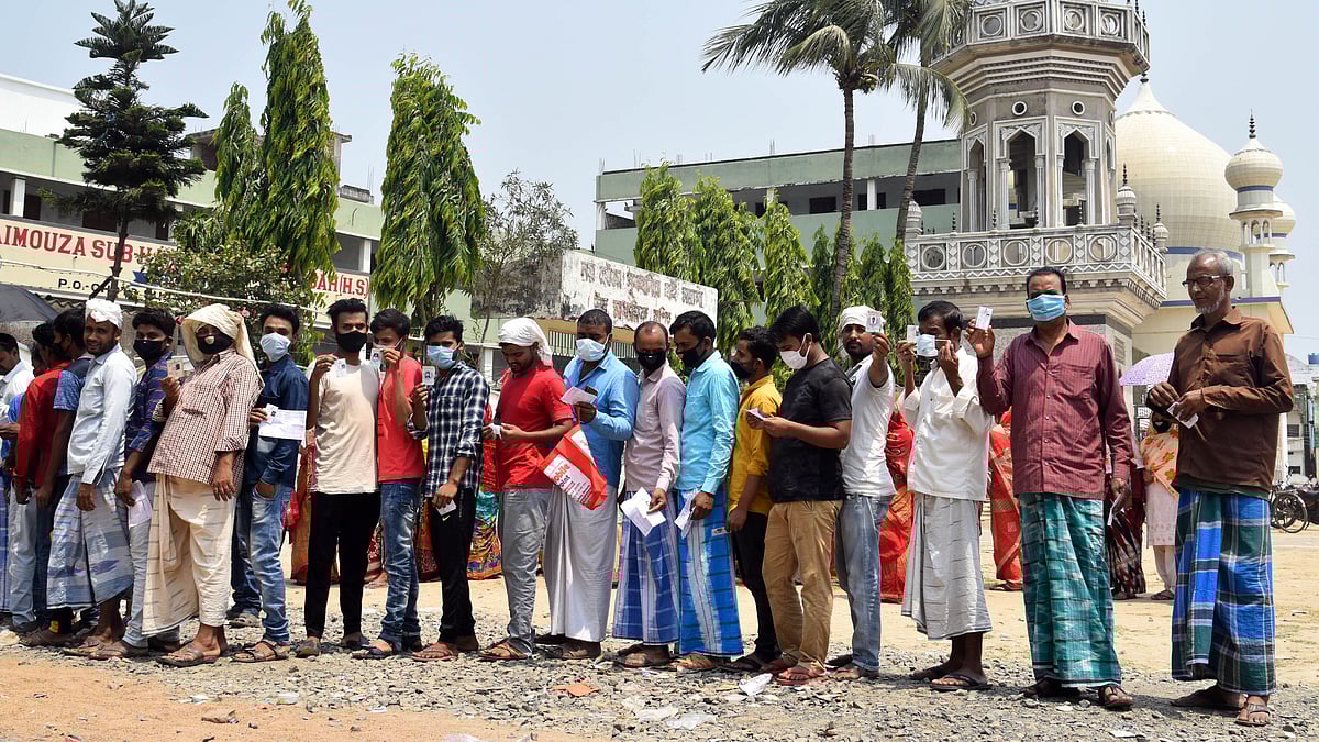 Voters show Voter-IDs as they arrive to cast their vote during the 8th and final phase of West Bengal Assembly election, in Malda on 29 April 2021
