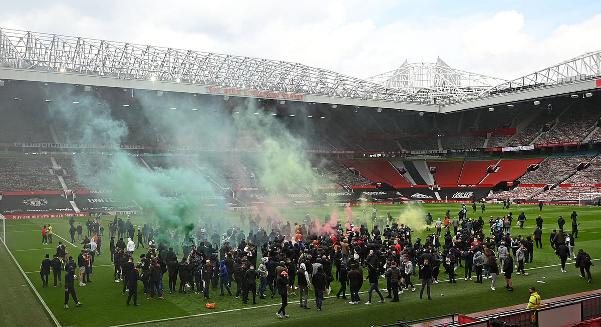 Supporters protest against Manchester United's owners, inside English Premier League club Manchester United's Old Trafford stadium in Manchester, north west England on 2 May, 2021, ahead of their English Premier League fixture against Liverpool
