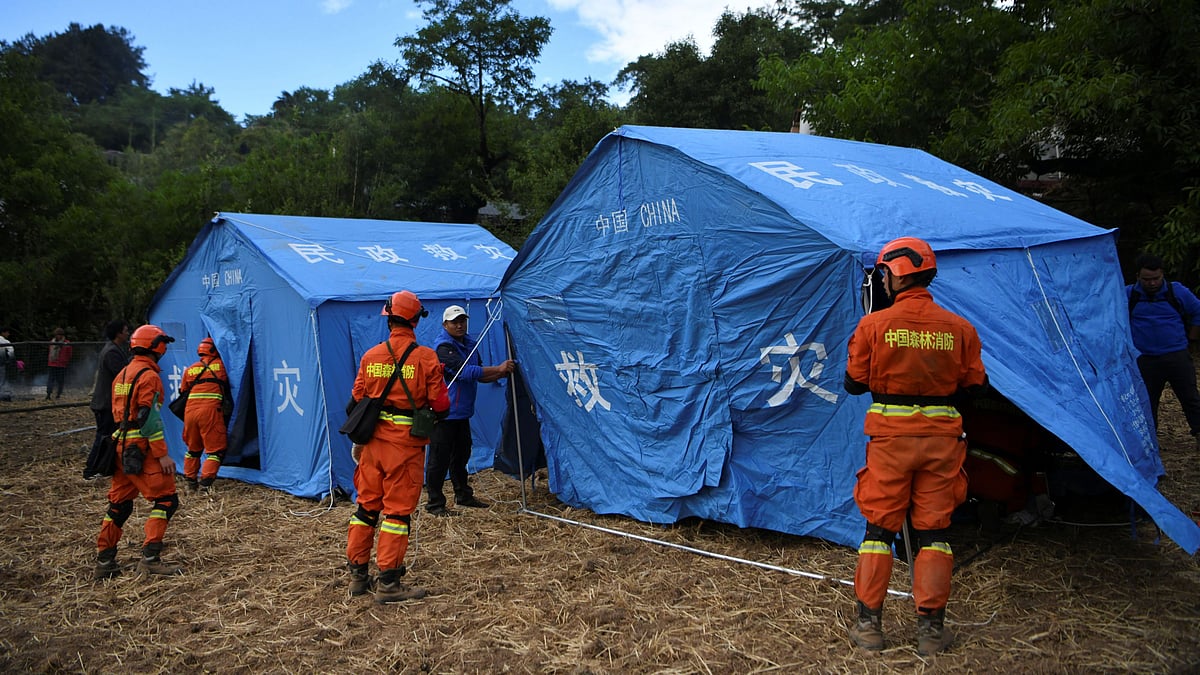 Rescue workers set up disaster relief tents following an earthquake in Yangbi county, Dali prefecture, Yunnan province, China on 22 May 2021