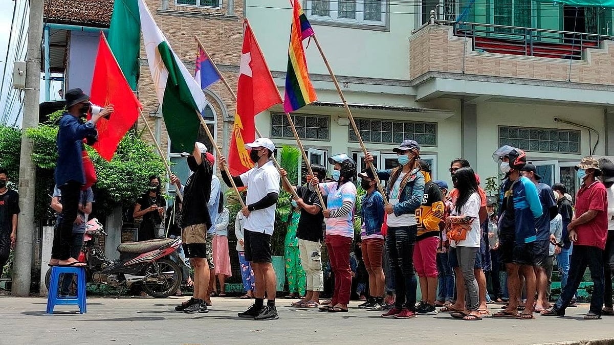 Demonstrators carry flags during a protest against the military coup, in Dawei, Myanmar on 27 April 2021