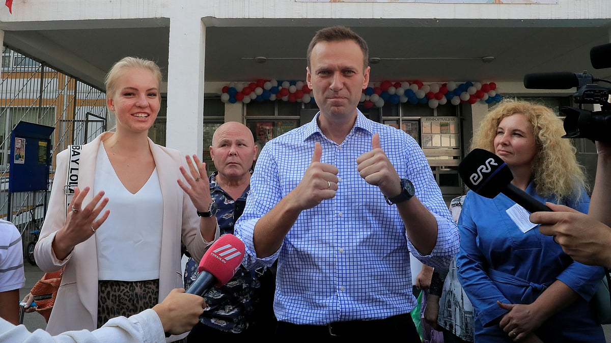 Russian opposition leader Alexei Navalny and his daughter Daria meet with journalists outside a polling station during the Moscow city parliament election in Moscow, Russia on 8 September 2019