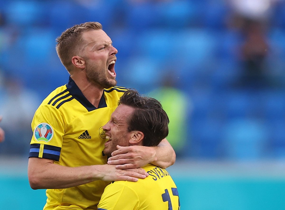 Sweden's Gustav Svensson and Sebastian Larsson celebrate after the match