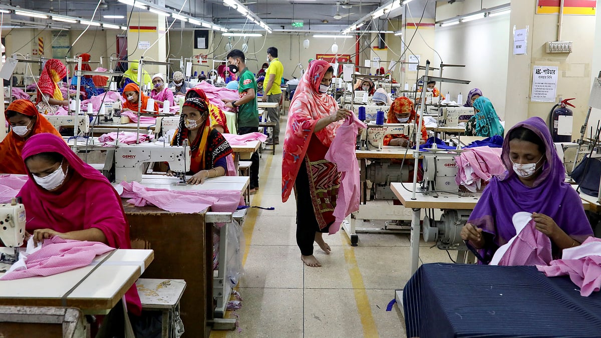 Women work in a garment factory in Dhaka, Bangladesh, on 3 May 2020