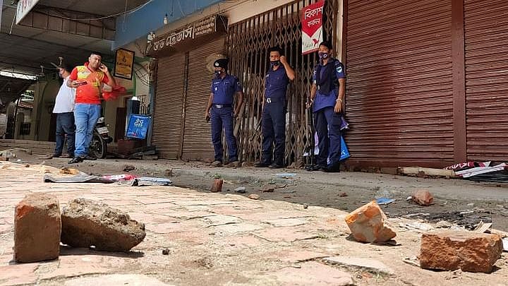 Police patrol the area after three people were shot dead in broad daylight at the Customs intersection of Kushtia town on Sunday.