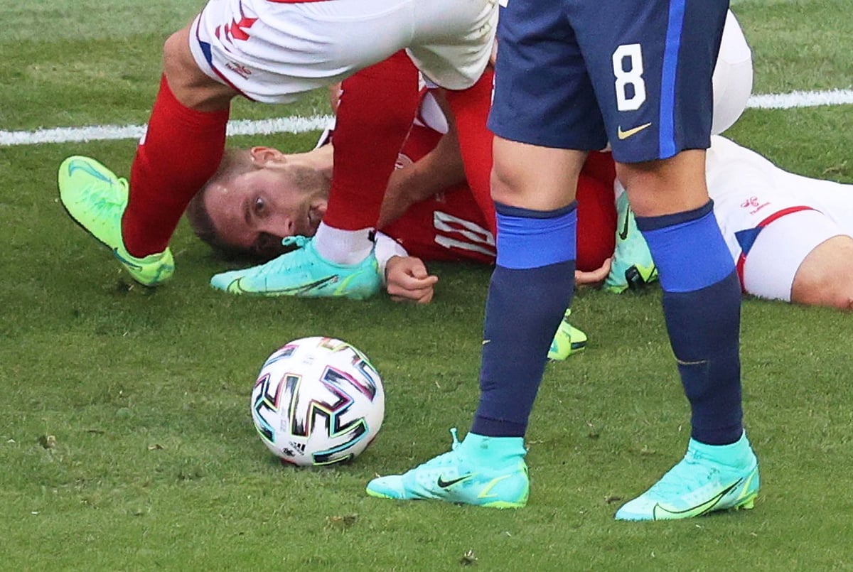 Denmark's Christian Eriksen is seen down on the pitch after collapsing during the match