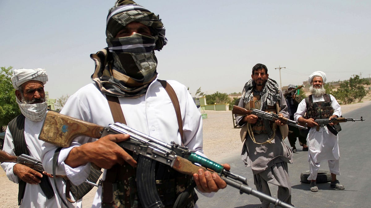 Former Mujahideen hold weapons to support Afghan forces in their fight against Taliban, on the outskirts of Herat province, Afghanistan on 10 July 2021