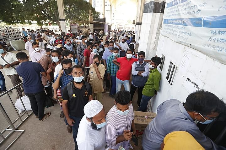 People crowd bus terminals, train stations and terry ghats as they head home ahead of Eid-ul-Azha as the government relaxed restrictions on 15 July.