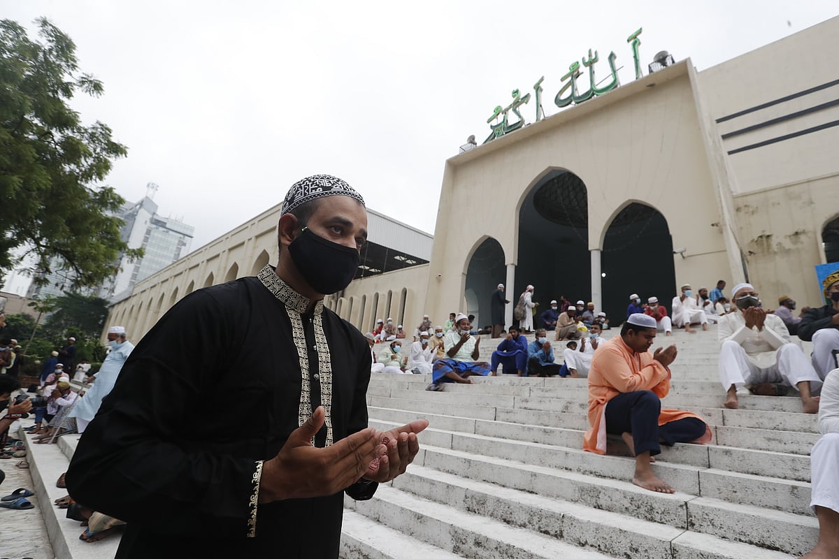 A Muslim devotee offer prayers at Baitul Mukarram National Mosque during the Eid-ul-Azha in Dhaka on 21 July 2021.