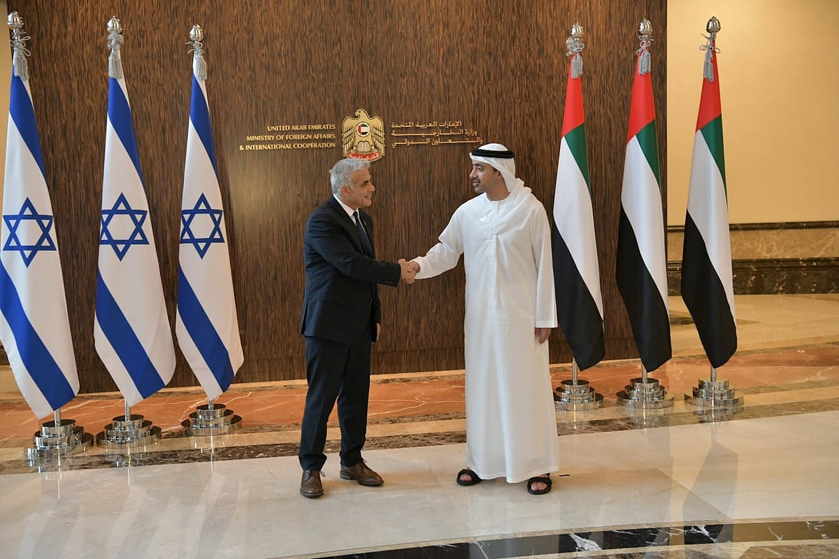 Israeli Foreign Minister Yair Lapid shakes hand with UAE Foreign Minister Sheikh Abdullah bin Zayed al-Nahyan during their meeting in Abu Dhabi, United Arab Emirates 29 June 2021