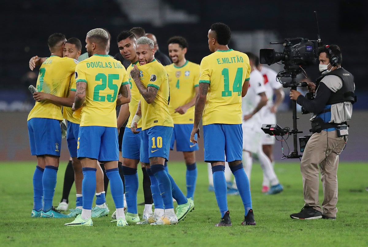 Brazil's Neymar celebrates after the match with teammates