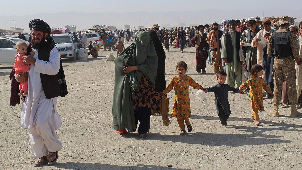 An Afghan family arrives at the Pakistan-Afghanistan border crossing point in Chaman on 20 August 2021, to return back to Afghanistan