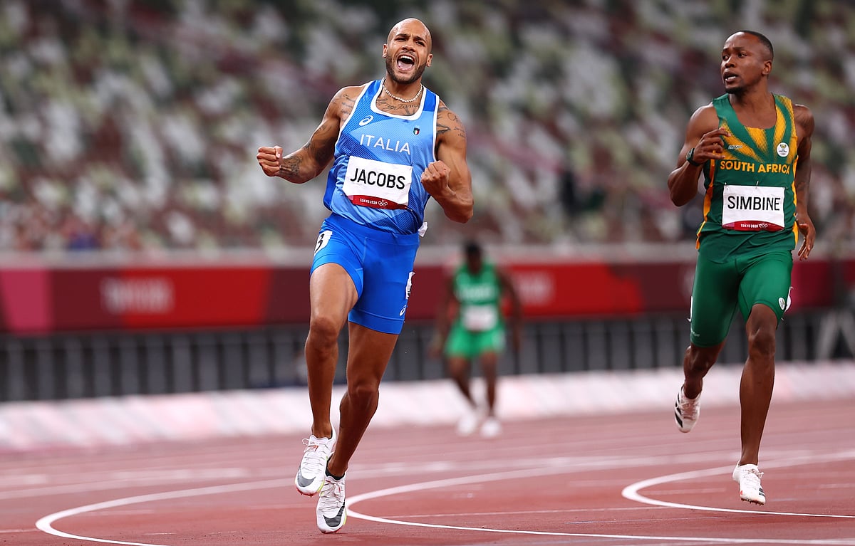 Lamont Marcell Jacobs of Italy celebrates after winning gold