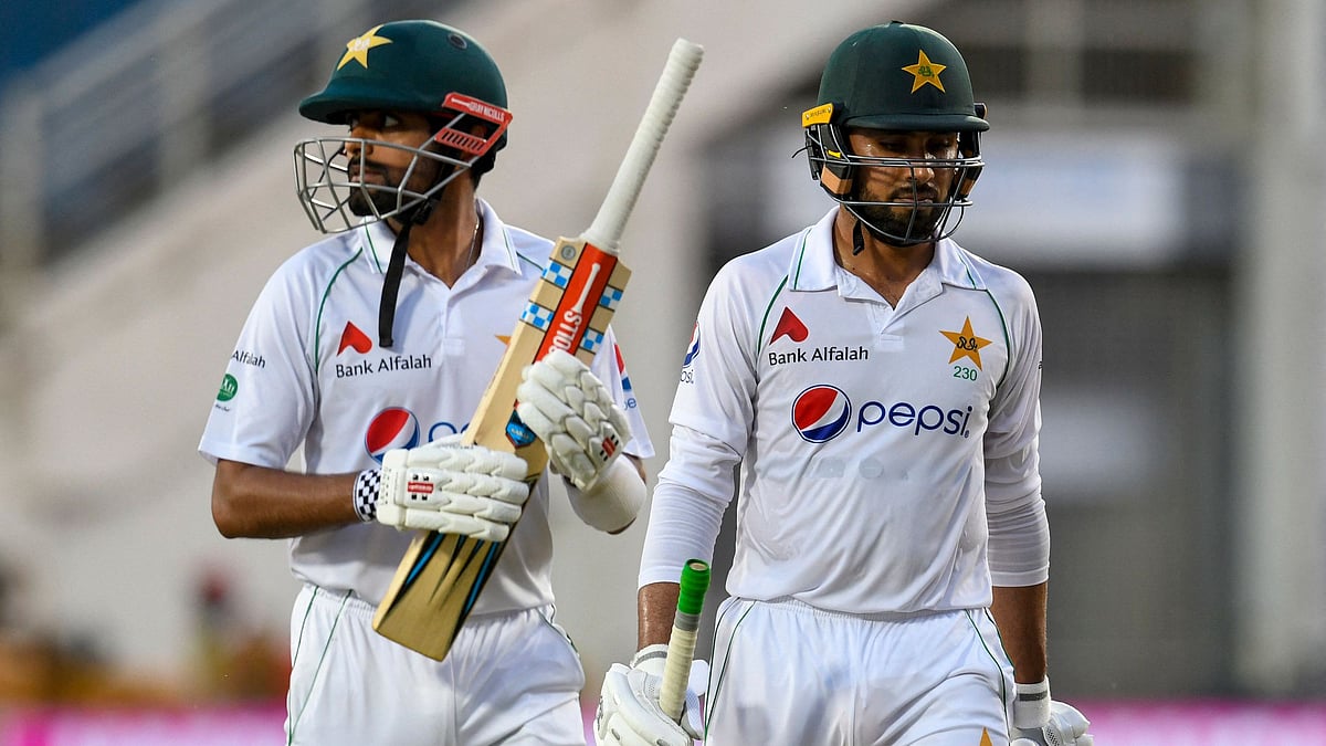 Babar Azam (L) and Faheem Ashraf (R) of Pakistan walk off the field at the end of day 3 of the 1st Test between West Indies and Pakistan at Sabina Park, Kingston, Jamaica, on 14 August 2021