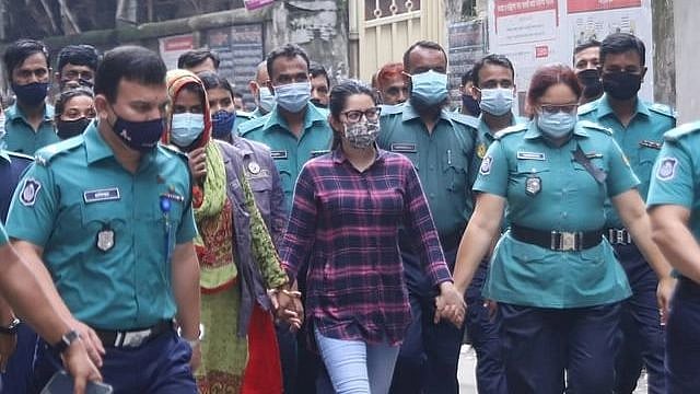 Actress Pori Moni surrounded by police