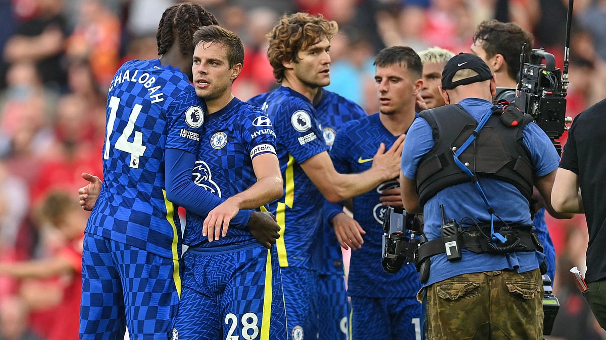 Chelsea's players celebrate holding on for a point after the English Premier League football match between Liverpool and Chelsea at Anfield in Liverpool, north west England on 28 August, 2021