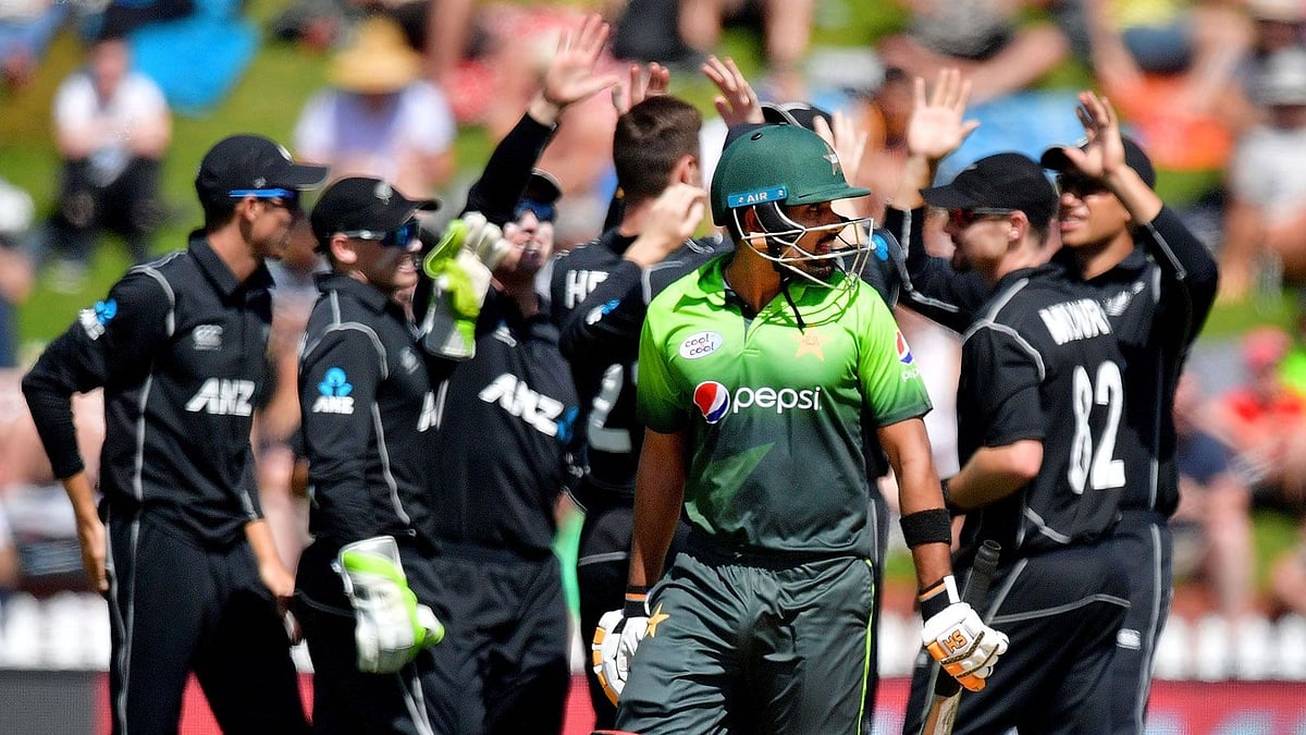 Pakistan's Babar Azam (C) walks from the field after being caught during the 5th one-day international cricket match between New Zealand and Pakistan at the Basin Reserve in Wellington on 19 January 2018.