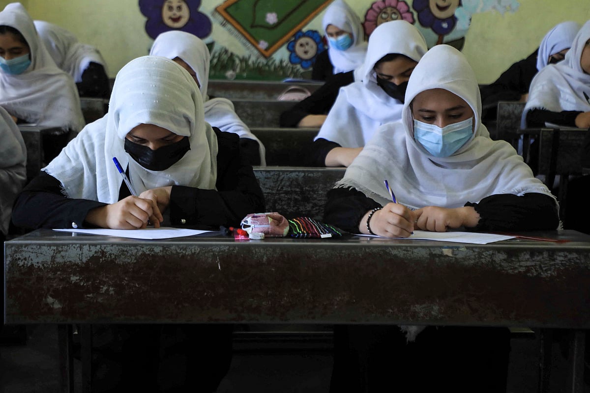 Schoolgirls attend class in Herat on 17 August 2021, following the Taliban stunning takeover of the country