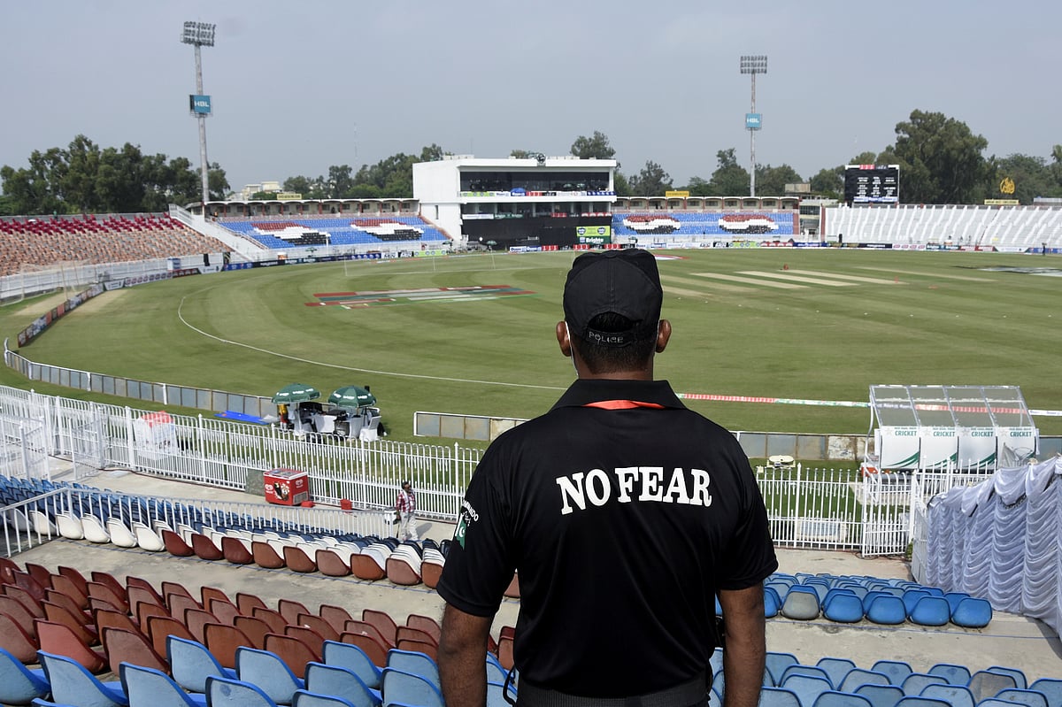 A member of the Police Elite Force stands guard at the Rawalpindi Cricket Stadium, after the New Zealand cricket team pulled out of a Pakistan cricket tour over security concerns, in Rawalpindi, Pakistan 17 September, 2021
