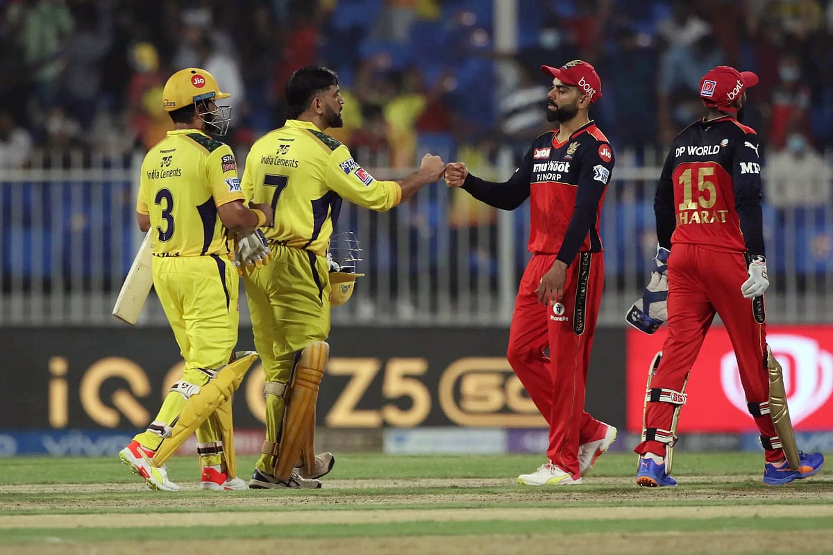 Captain of Chennai Super Kings Mahendra Singh Dhoni and captain of Royal Challengers Bangalore Virat Kohli greet each other after the Vivo IPL match between the Chennai Super Kings and the Royal Challengers Bangalore, at the Sharjah Cricket Stadium, in Sharjah on Friday