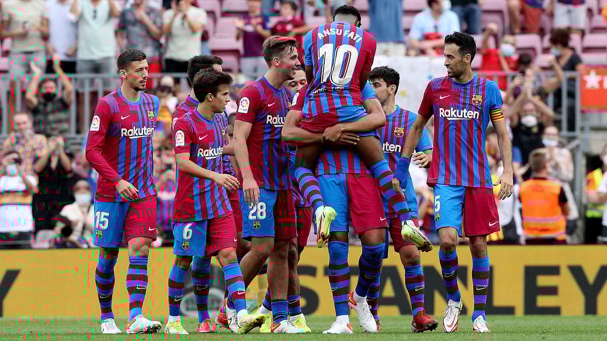 FC Barcelona's Ansu Fati celebrates scoring their third goal with teammates on at Camp Nou on 26 September, 2021