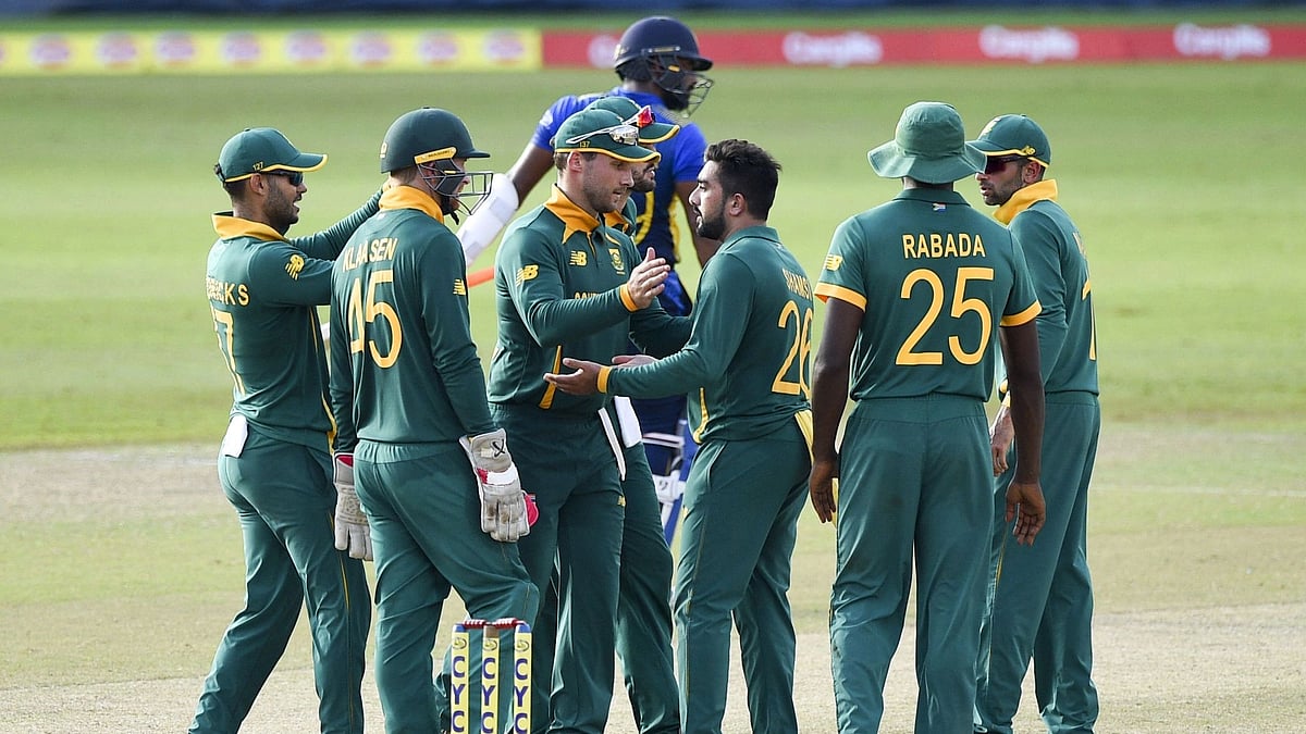 South Africa's Tabraiz Shamsi (3R) celebrates with teammates after the dismissal of Sri Lanka's Chamika Karunaratne during the third ODI at the R. Premadasa Stadium in Colombo on 7 September 2021