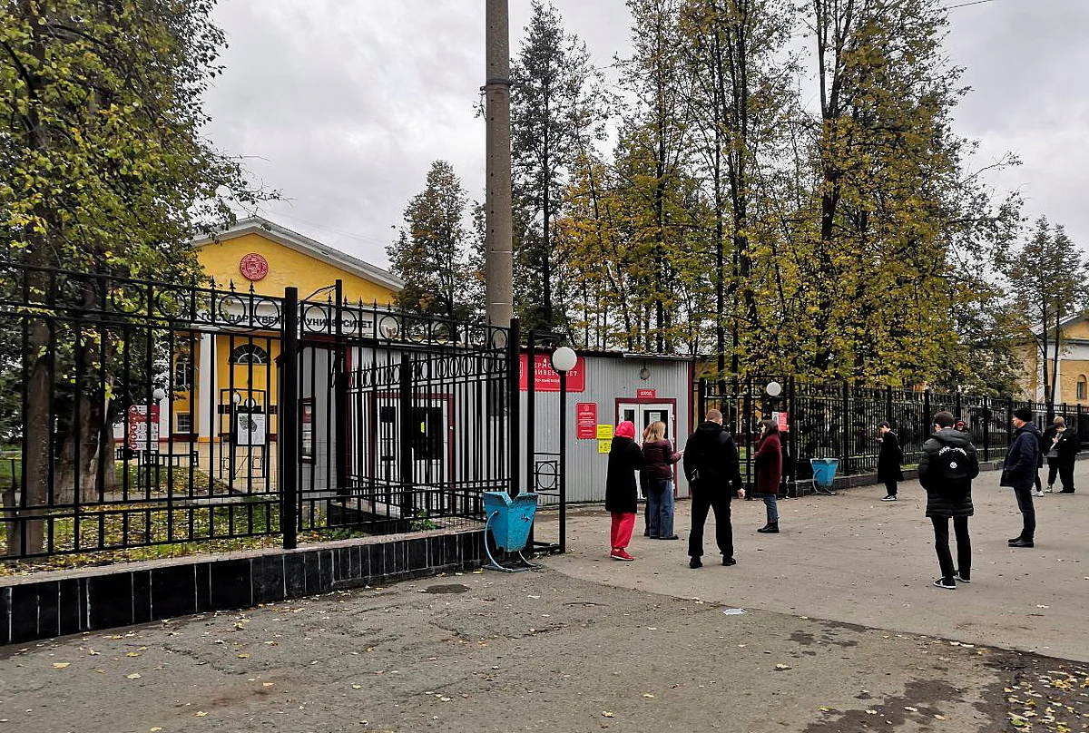 People gather outside the Perm State University after a gunman opened fire there, in Perm, Russia September 20, 2021
