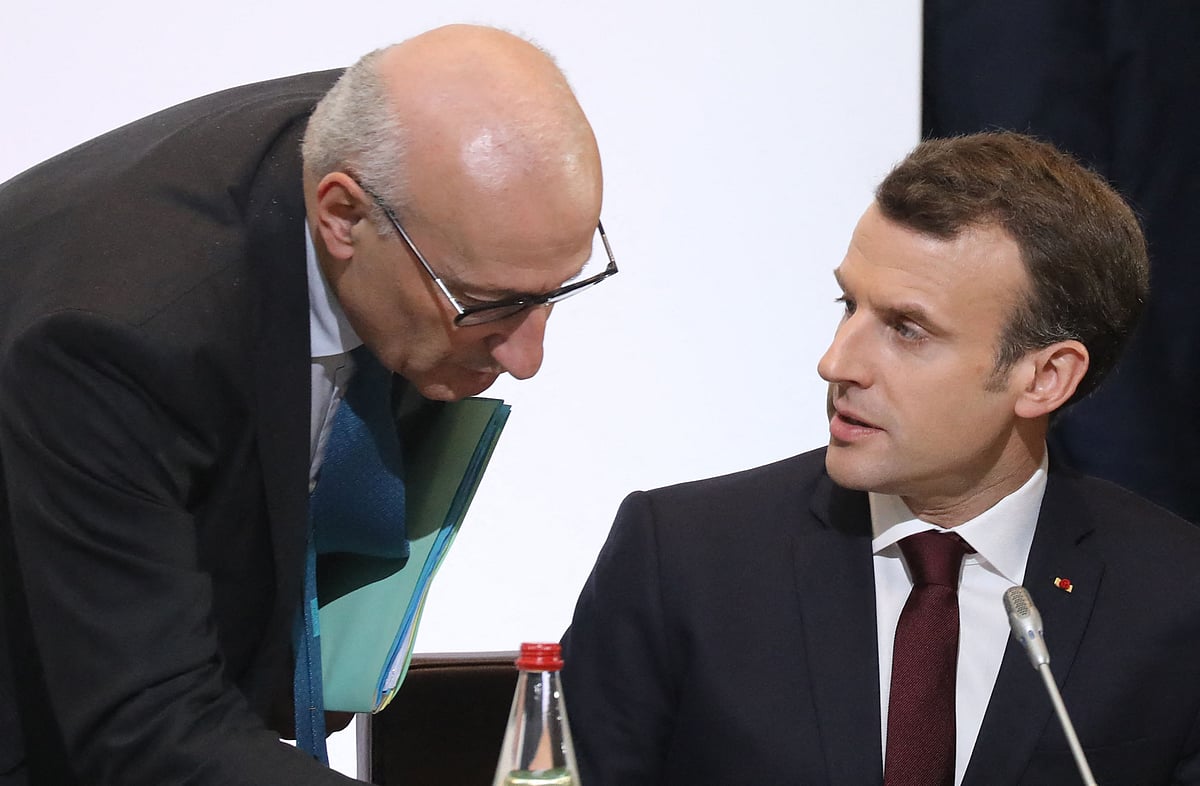 n this file photo taken on 6 April 2018 French president Emmanuel Macron (R) speaks with presidential diplomatic advisor Philippe Etienne as they take part in the Cedre conference at The Foreign Affairs Ministry in Paris