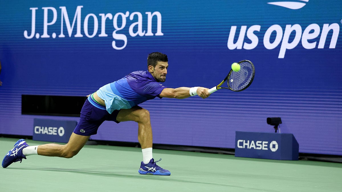 Serbia's Novak Djokovic hits a return to Italy's Matteo Berrettini during their 2021 US Open Tennis tournament men's quarter-finals match at the USTA Billie Jean King National Tennis Center in New York, on 8 September, 2021