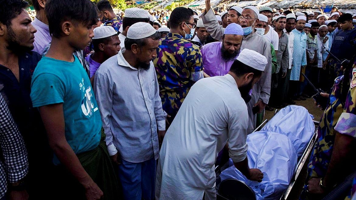 The body of Mohib Ullah, a leader of the Arakan Rohingya Society for Peace and Human Rights, is brought for the funeral at the Kutupalang camp in Cox’s Bazar, Bangladesh, on 30 September 2021