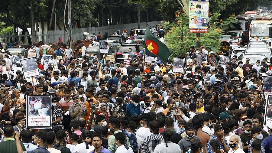 Students hold protest programme in Shahbagh on Monday over the attacks on temples, houses and businesses of Hindu people.