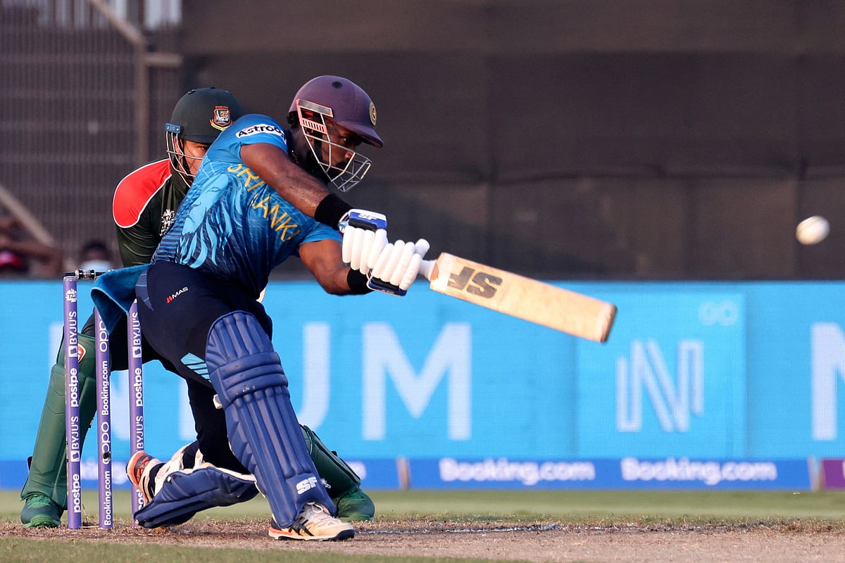 Sri Lanka's Charith Asalanka plays a shot during the ICC men’s Twenty20 World Cup cricket match between Sri Lanka and Bangladesh at the Sharjah Cricket Stadium in Sharjah on October 24, 2021