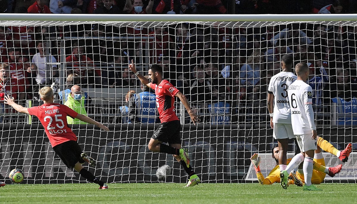 Rennes' French forward Gaetan Laborde (C) celebrates after scoring during the French L1 football match between Stade Rennais (Rennes) and Paris Saint-Germain at the Roazhon Park in Rennes on 3 October 2021.