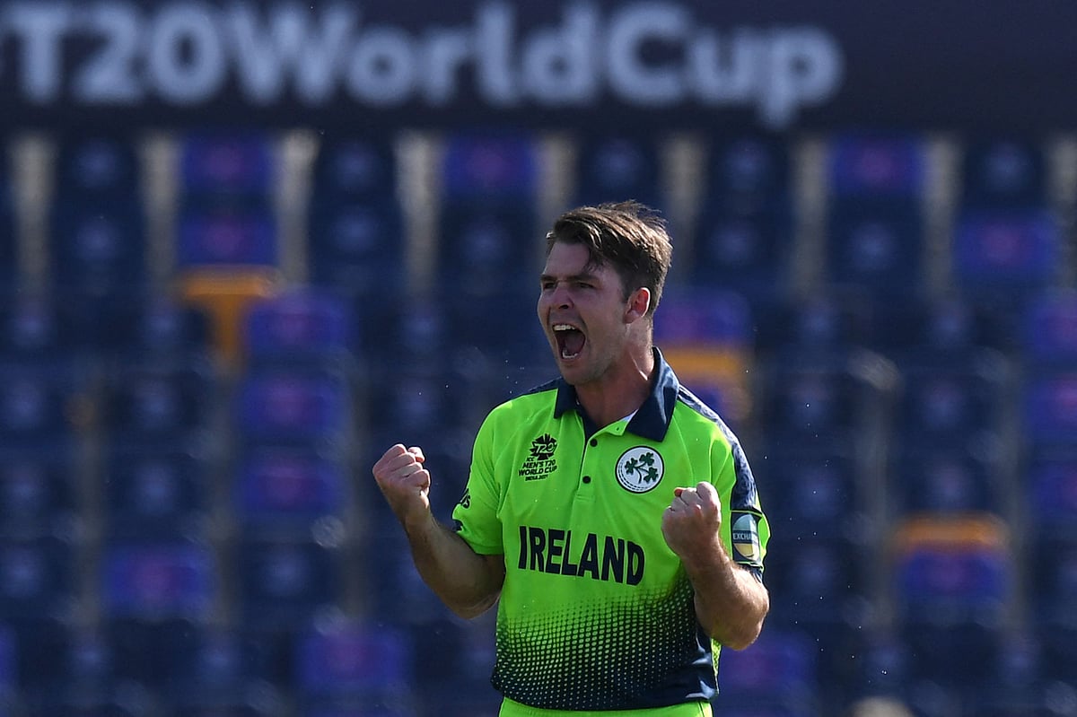 Ireland's Curtis Campher celebrates after the dismissal of Netherland's Ryan ten Doeschate (not pictured) during the ICC men’s Twenty20 World Cup cricket match between Ireland and Netherlands at the Sheikh Zayed Stadium in Abu Dhabi on 18 October 2021.