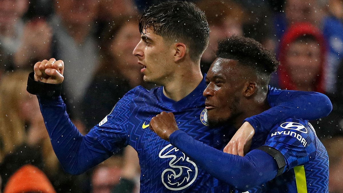 Chelsea's German midfielder Kai Havertz (l) celebrates scoring his team's third goal WITH Chelsea's English midfielder Callum Hudson-Odoi during the Champions League group H football match between Chelsea and Malmo FF at Stamford Bridge in London on 20 October, 2021