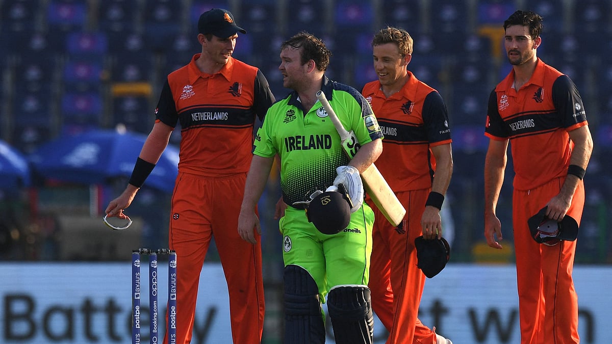Ireland's Paul Stirling (2L) is greeted by Netherland's players after the ICC men’s Twenty20 World Cup cricket match between Ireland and Netherlands at the Sheikh Zayed Stadium in Abu Dhabi on 18 October 2021.